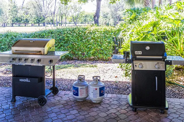 a front view of a house with a yard garage and outdoor seating