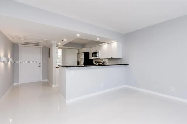 a view of a kitchen with a sink
