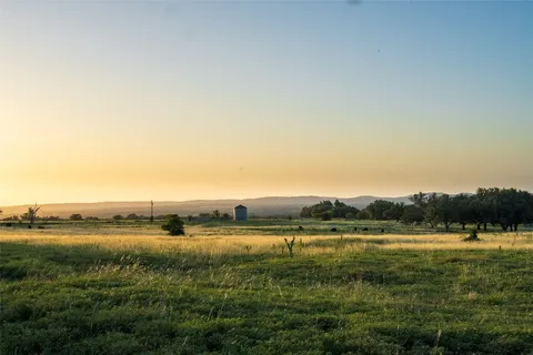 a view of a lake with houses in the background