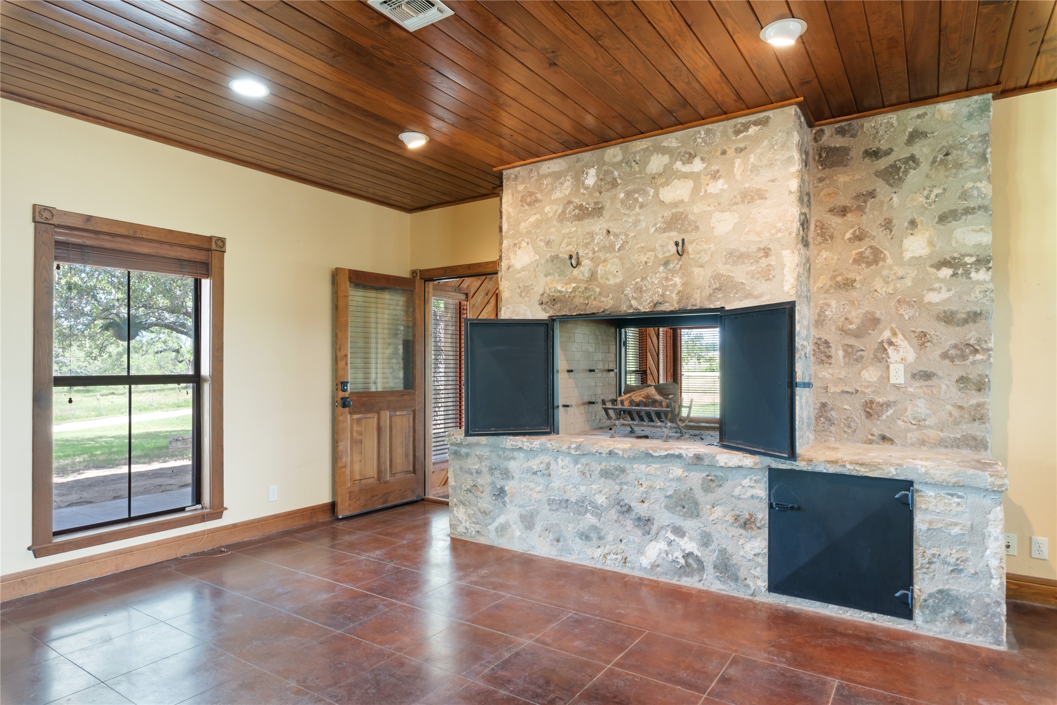 125 Hye Albert Road Hye, TX 78635 - Photo 17 of 39 Unfurnished living room with wood ceiling, recessed lighting, and tile patterned flooring