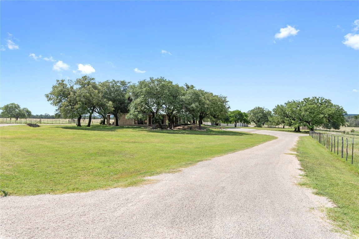 125 Hye Albert Road Hye, TX 78635 - Photo 19 of 39 a view of a swimming pool and a yard
