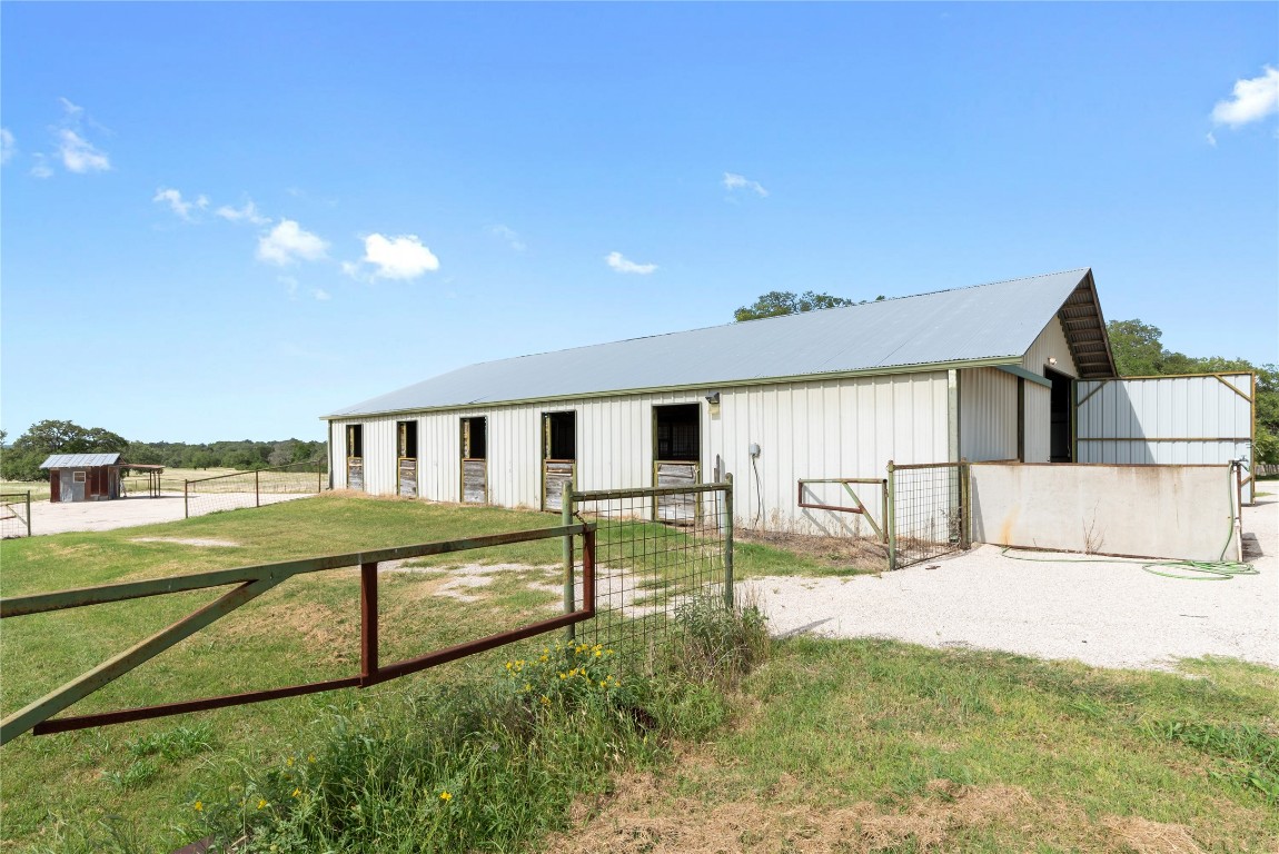 125 Hye Albert Road Hye, TX 78635 - Photo 24 of 39 a view of a house with backyard and a tree