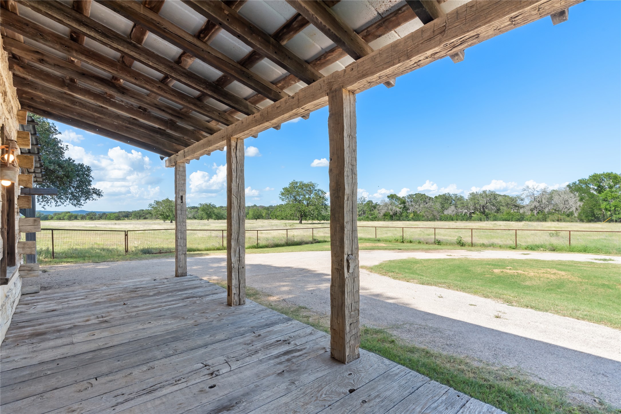 125 Hye Albert Road Hye, TX 78635 - Photo 29 of 39 Wooden deck featuring view of scattered trees and a view of rural / pastoral area