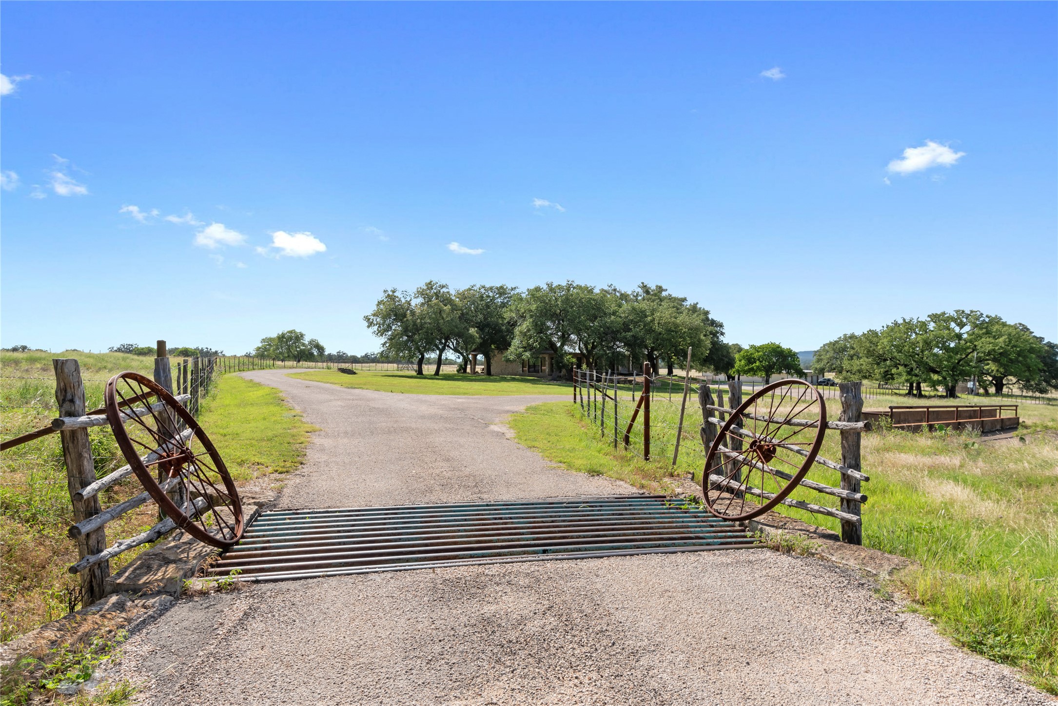 125 Hye Albert Road Hye, TX 78635 - Photo 32 of 39 View of asphalt driveway with a view of rural / pastoral area and a gated entry
