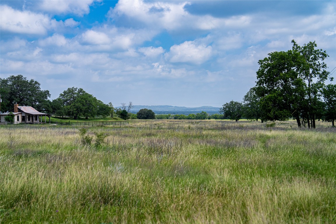 125 Hye Albert Road Hye, TX 78635 - Photo 39 of 39 a view of a green field with wooden fence