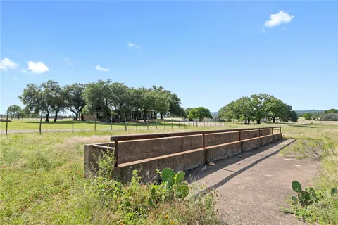 a view of a garden with a swimming pool