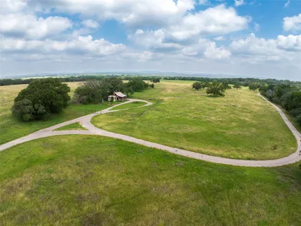 a view of a swimming pool with a yard