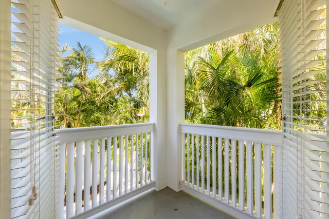 a view of a balcony with plants