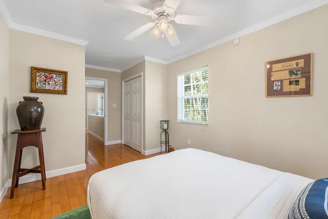 a bedroom with a bed and a chair