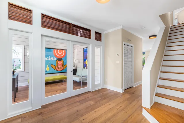 a view of an entryway with wooden floor