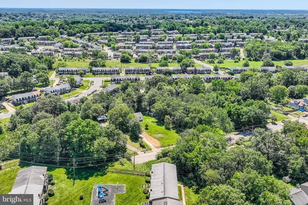an aerial view of a houses with a yard