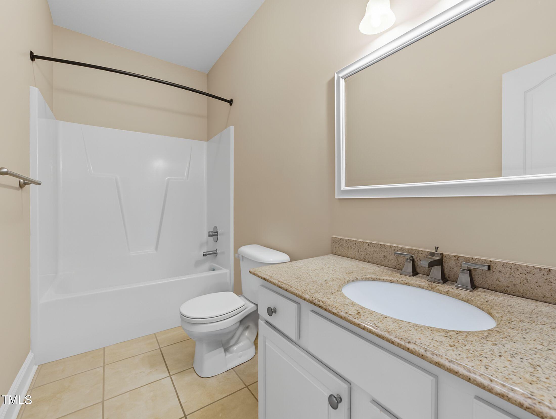 1709 Shell Cracker Drive Willow Spring, NC 27592 - Photo 14 of 28 a bathroom with a granite countertop sink toilet and shower