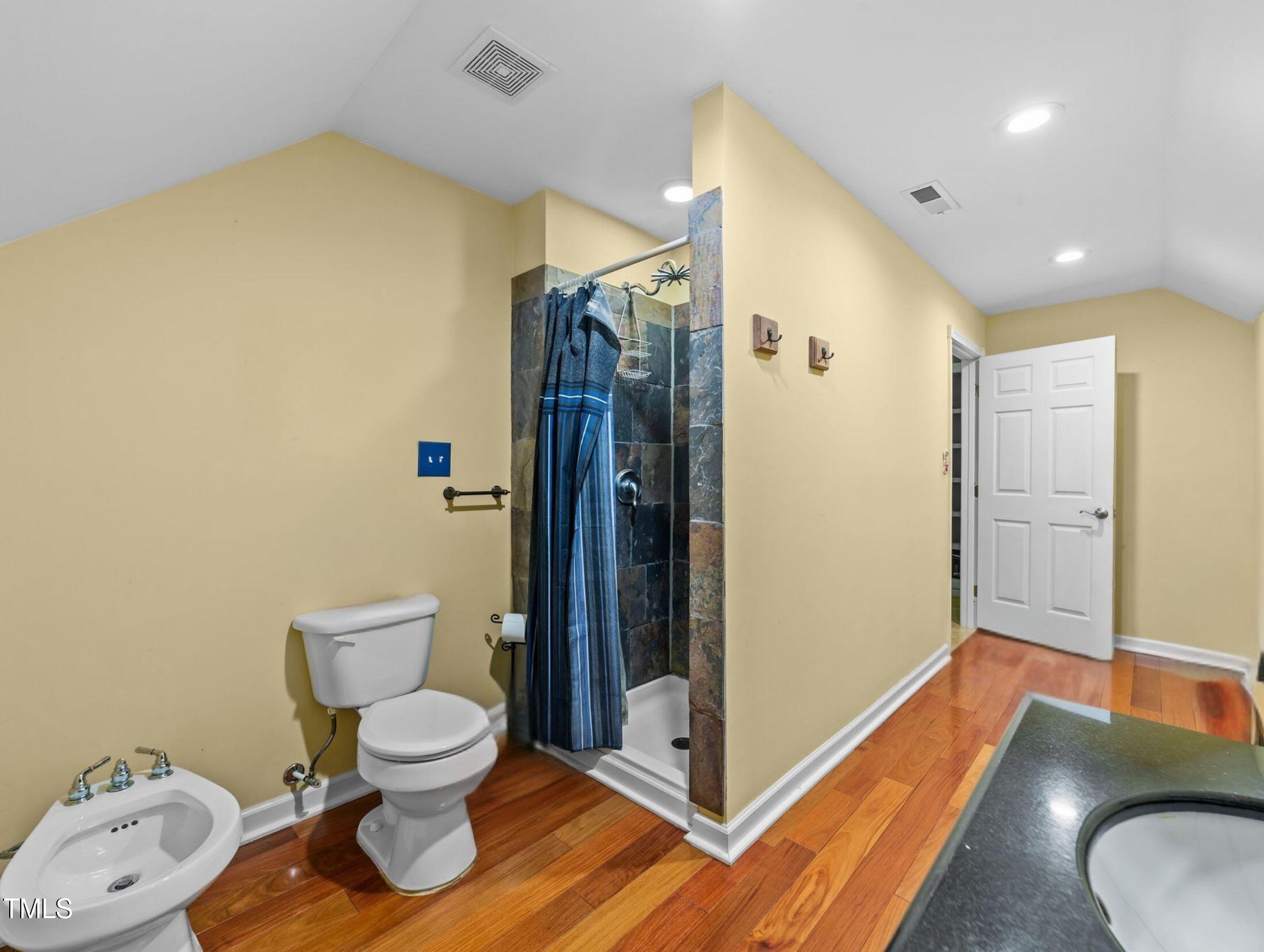 1709 Shell Cracker Drive Willow Spring, NC 27592 - Photo 17 of 28 a bathroom with a toilet and a shower