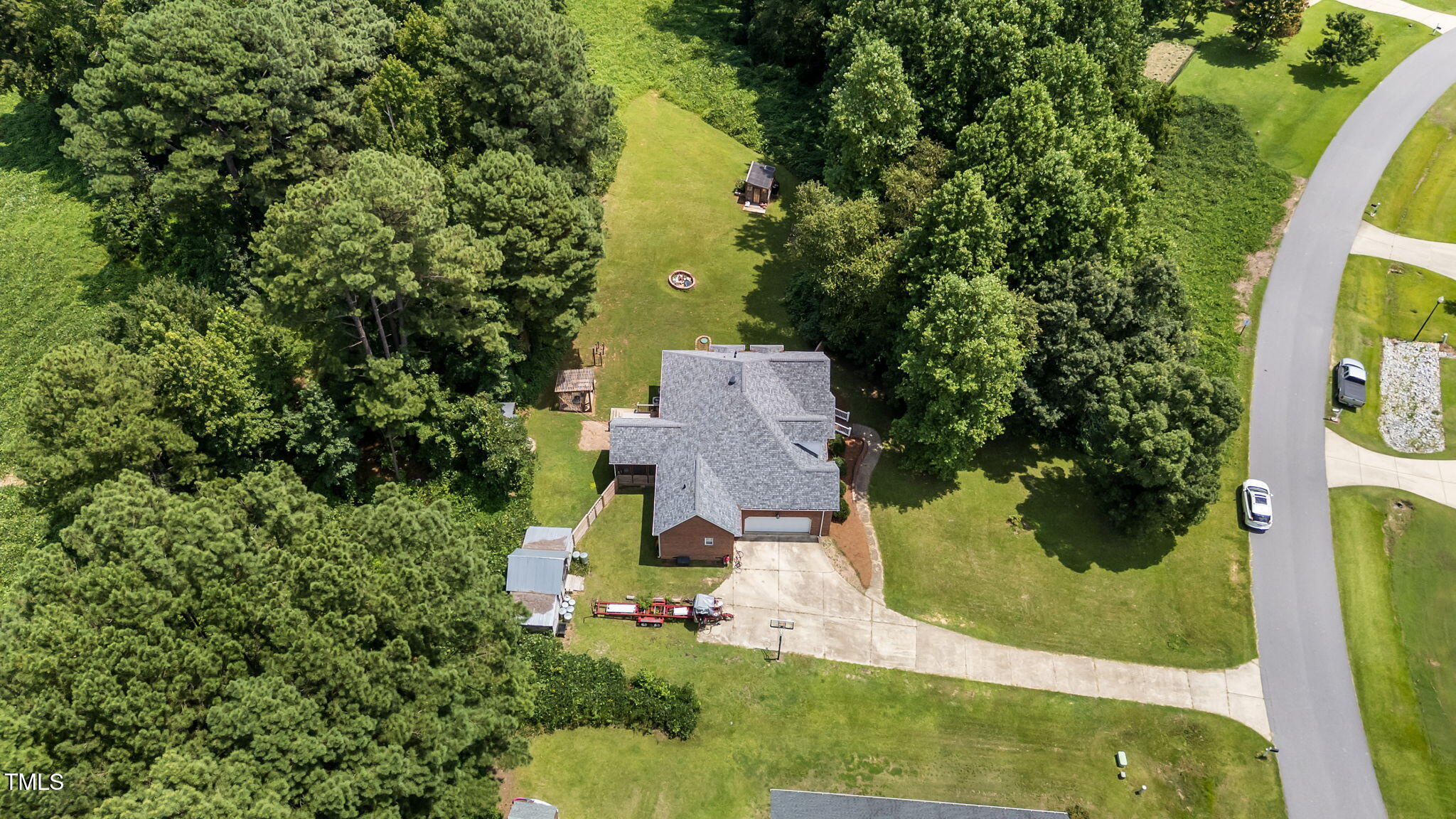 1709 Shell Cracker Drive Willow Spring, NC 27592 - Photo 21 of 28 an aerial view of a house with swimming pool and garden view