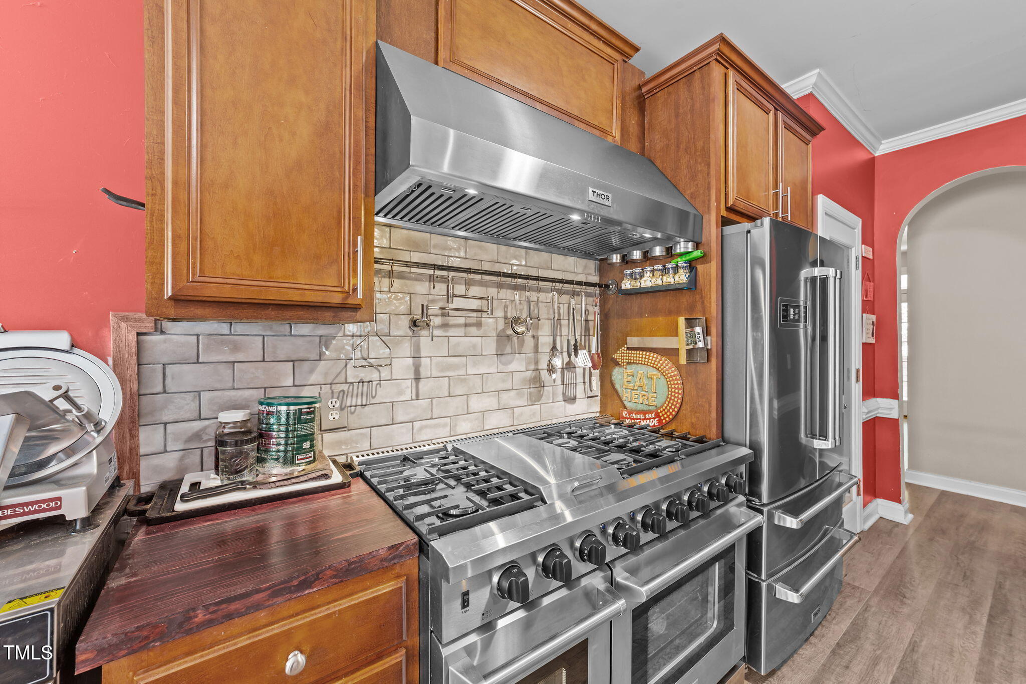 1709 Shell Cracker Drive Willow Spring, NC 27592 - Photo 7 of 28 a kitchen with a stove and a wooden cabinets