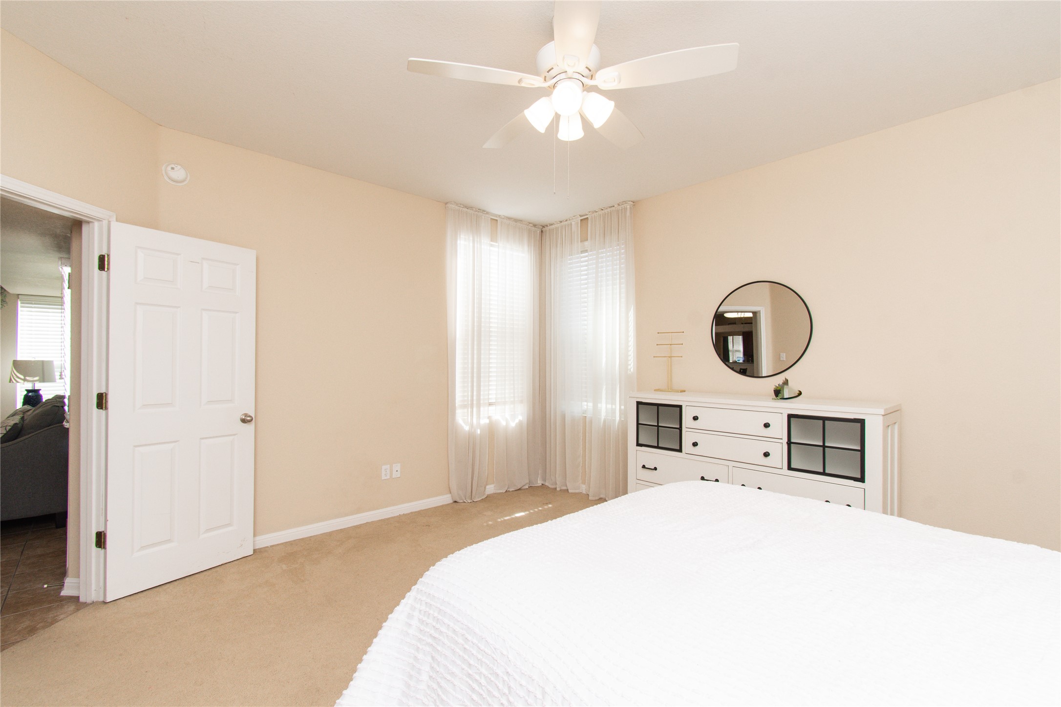 421 Shadow Point San Marcos, TX 78666 - Photo 12 of 24 Bedroom featuring light carpet and a ceiling fan