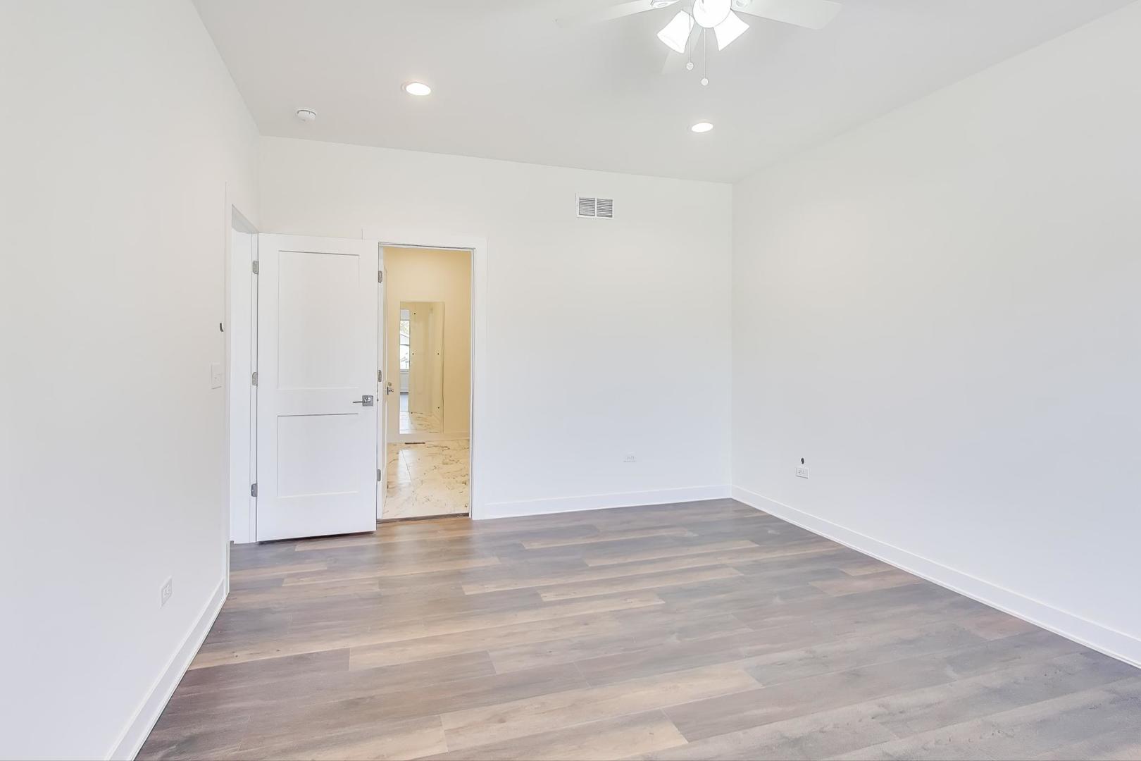 898 North Quentin Road Palatine, IL 60067 - Photo 13 of 28 wooden floor in an empty room