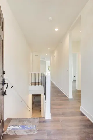 a view of entryway with wooden floor