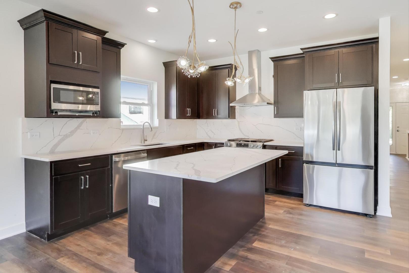898 North Quentin Road Palatine, IL 60067 - Photo 9 of 28 a kitchen with a refrigerator a sink and a oven