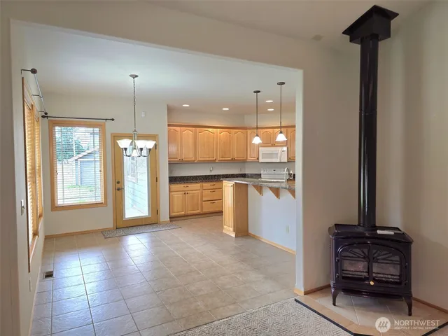 a kitchen with a sink cabinets and window
