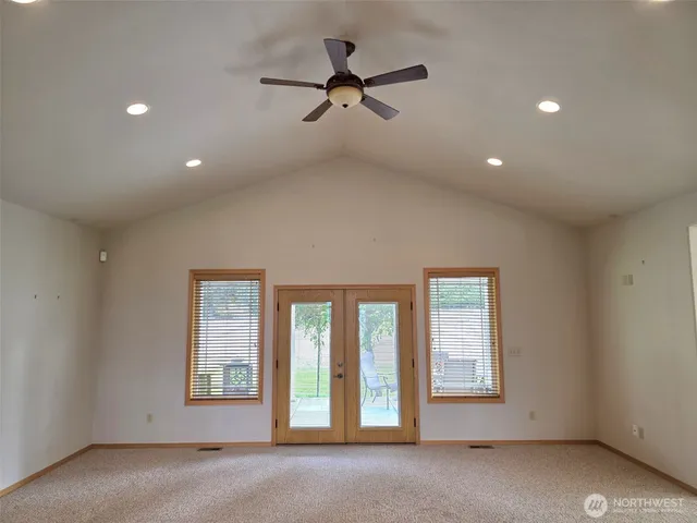 a view of an empty room with a window