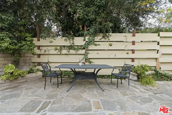 a view of outdoor space with seating area and trees