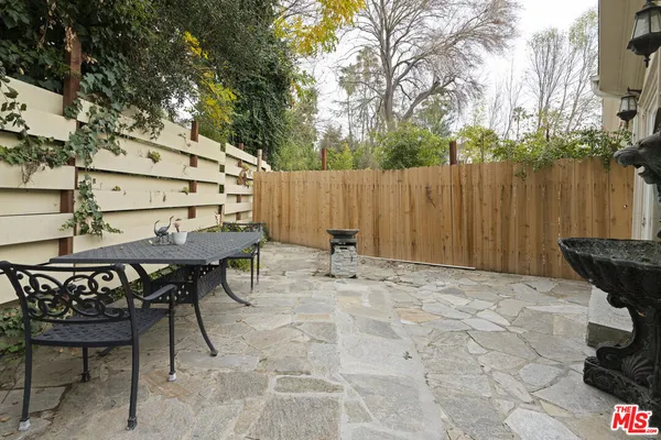 a view of outdoor space with table and chairs