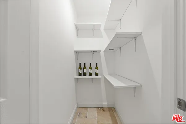 a view of storage and utility room with closet