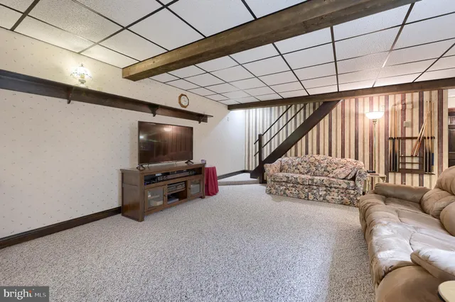 a room with furniture and a chandelier