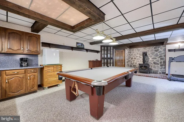 a view of a chairs and table on the wooden floor