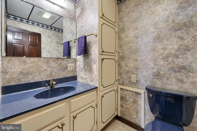 a view of backyard with seating space and trees