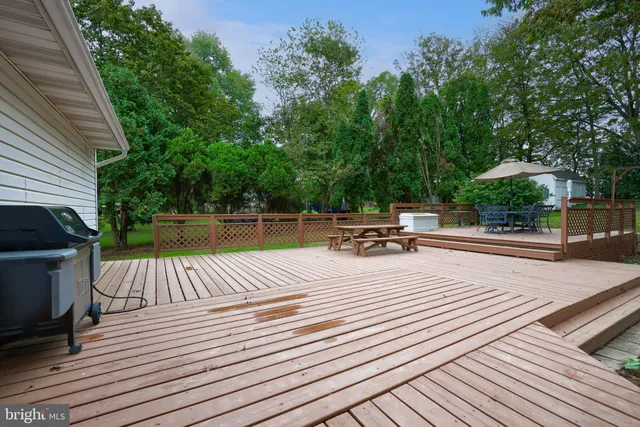 a view of a field of grass and trees