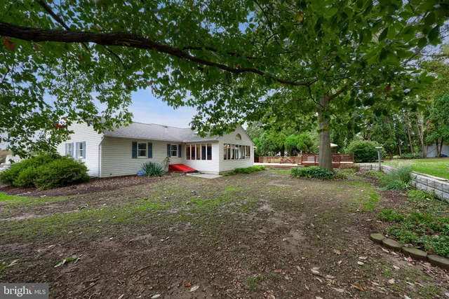 a view of a house with wooden fence