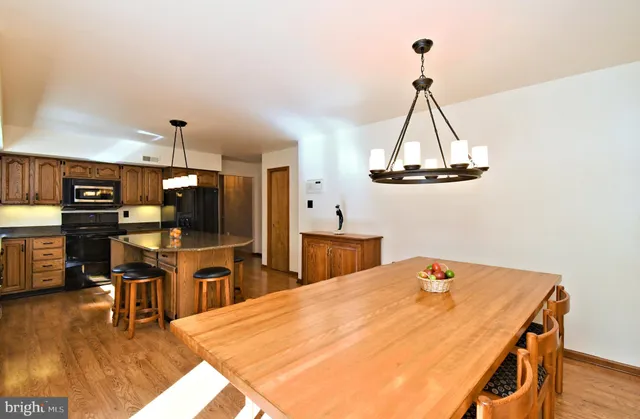 a dining room with a table and chairs