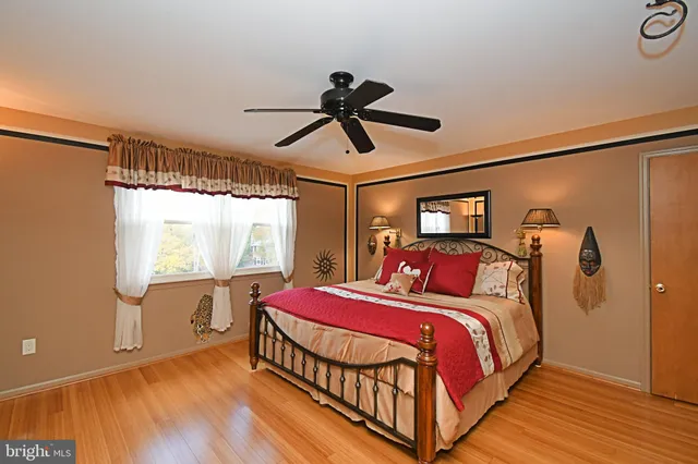 a bedroom with a bed and window