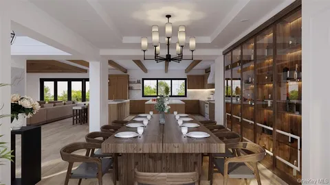 a view of a dining room with furniture and chandelier
