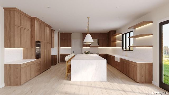 a large white room with a large window and wooden floors