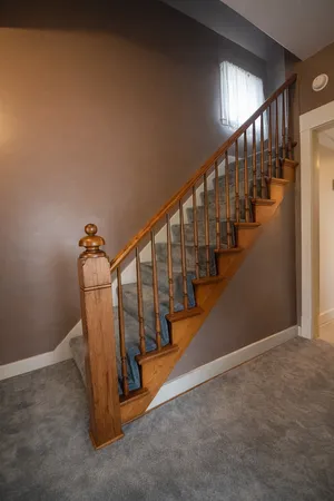 a view of a livingroom with furniture and a ceiling fan
