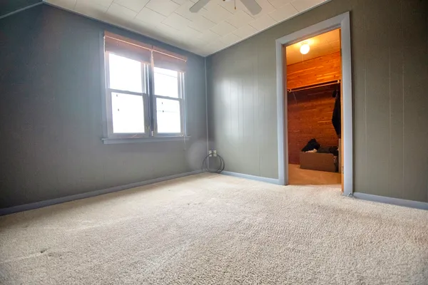 a bathroom with a toilet a sink and a mirror
