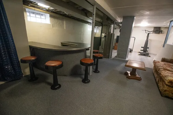 a view of a swimming pool with an outdoor space and seating area