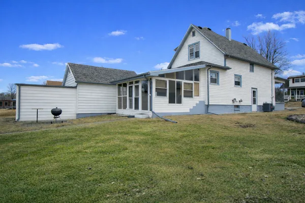 an aerial view of residential house with outdoor space and river