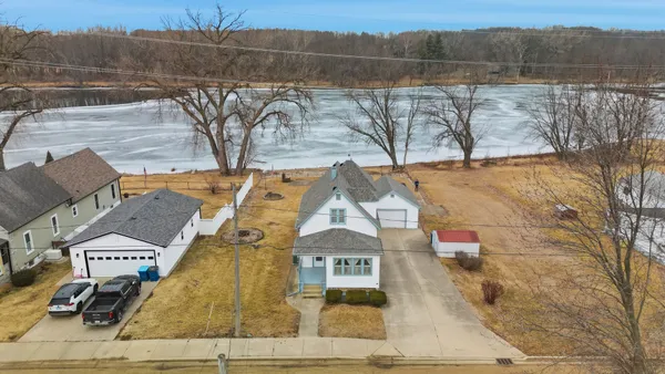 a view of dirt yard with a large tree
