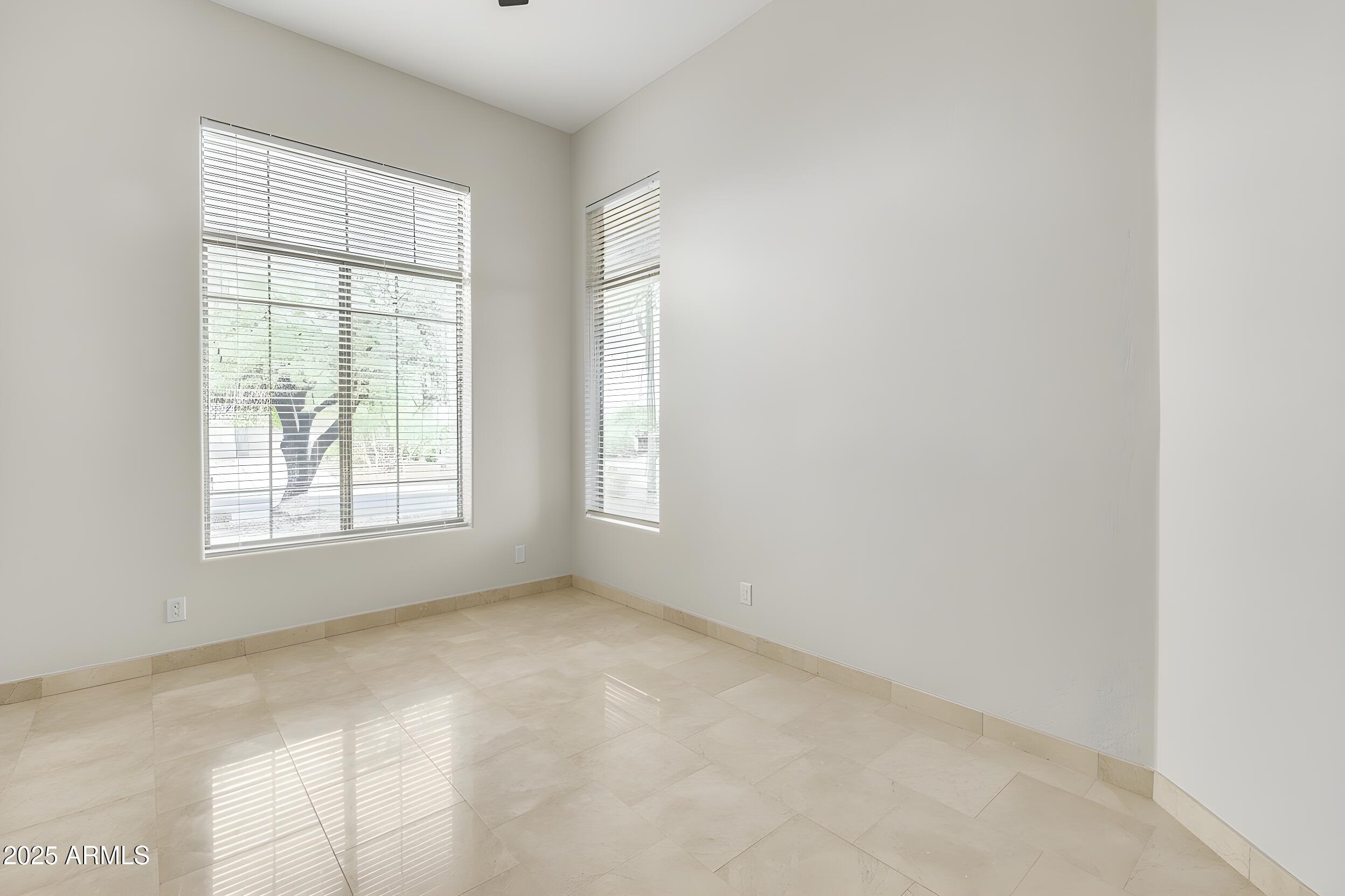 3138 West Ravina Lane Anthem, AZ 85086 - Photo 10 of 38 a view of an empty room with a window