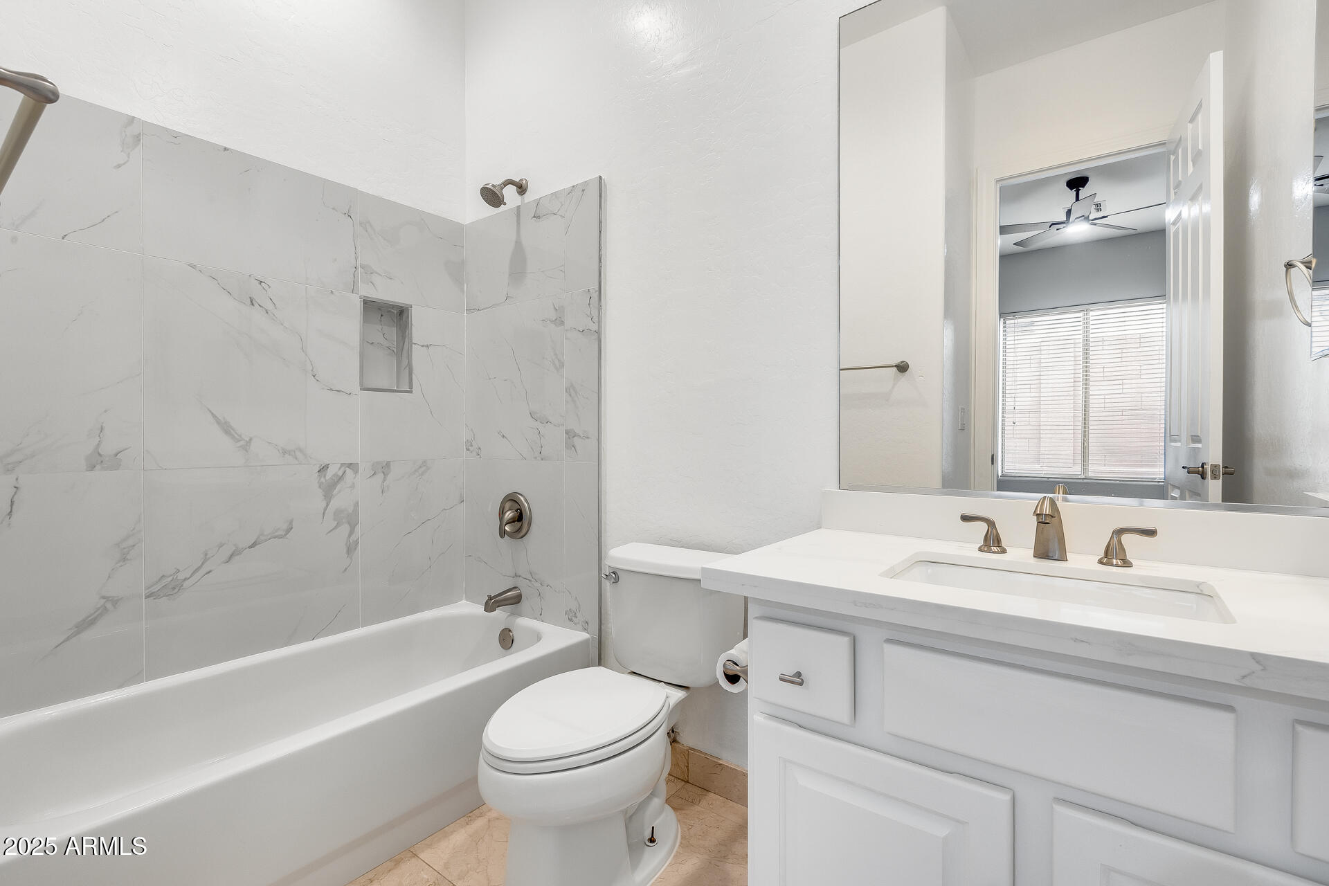3138 West Ravina Lane Anthem, AZ 85086 - Photo 14 of 38 a bathroom with a sink a toilet and a bathtub