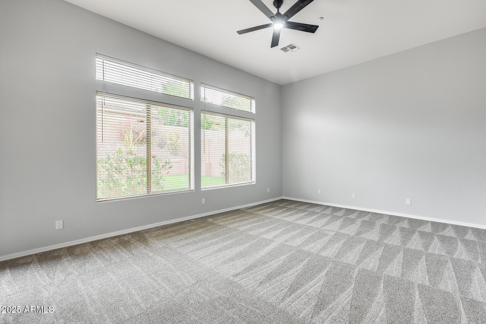 3138 West Ravina Lane Anthem, AZ 85086 - Photo 16 of 38 a view of an empty room with a window