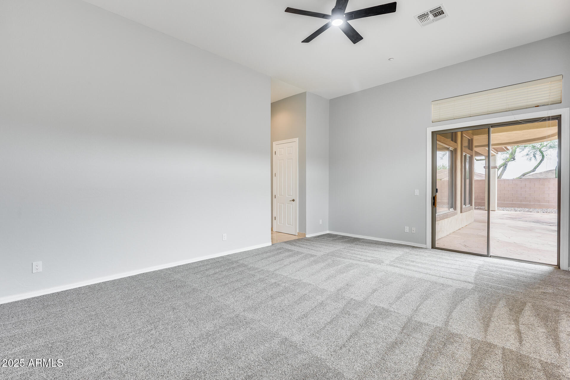 3138 West Ravina Lane Anthem, AZ 85086 - Photo 17 of 38 wooden floor in an empty room with a window