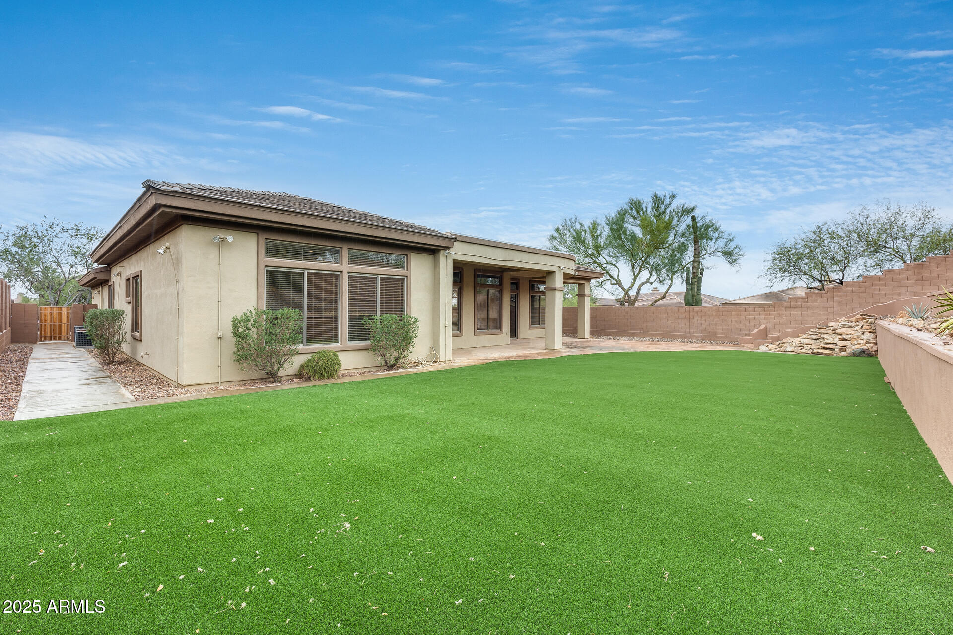 3138 West Ravina Lane Anthem, AZ 85086 - Photo 23 of 38 a view of a house with a backyard