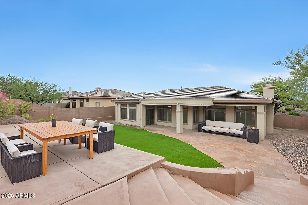 3138 West Ravina Lane Anthem, AZ 85086 - Photo 24 of 38 a view of a house with a patio