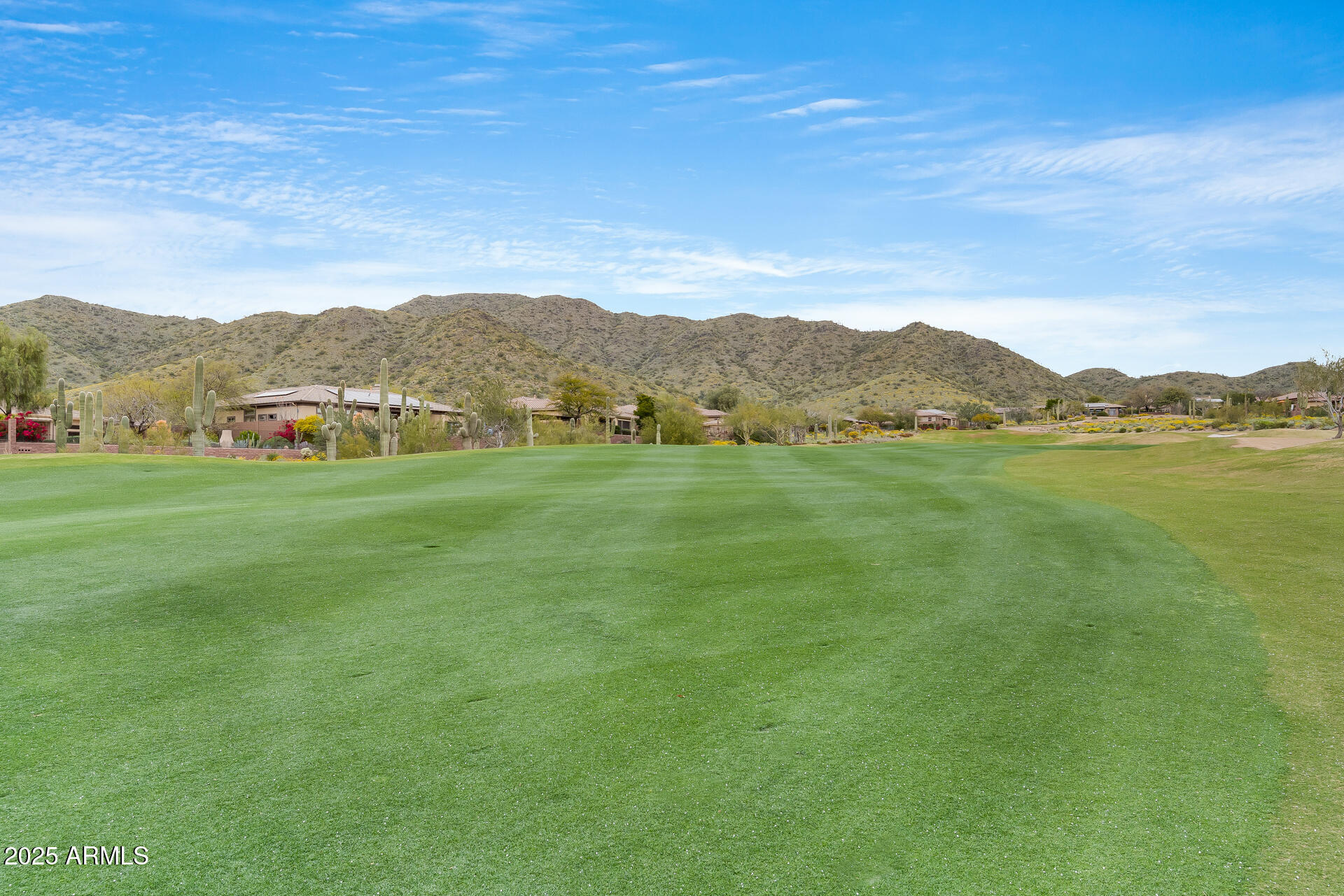3138 West Ravina Lane Anthem, AZ 85086 - Photo 34 of 38 a view of an ocean with a mountain in the background