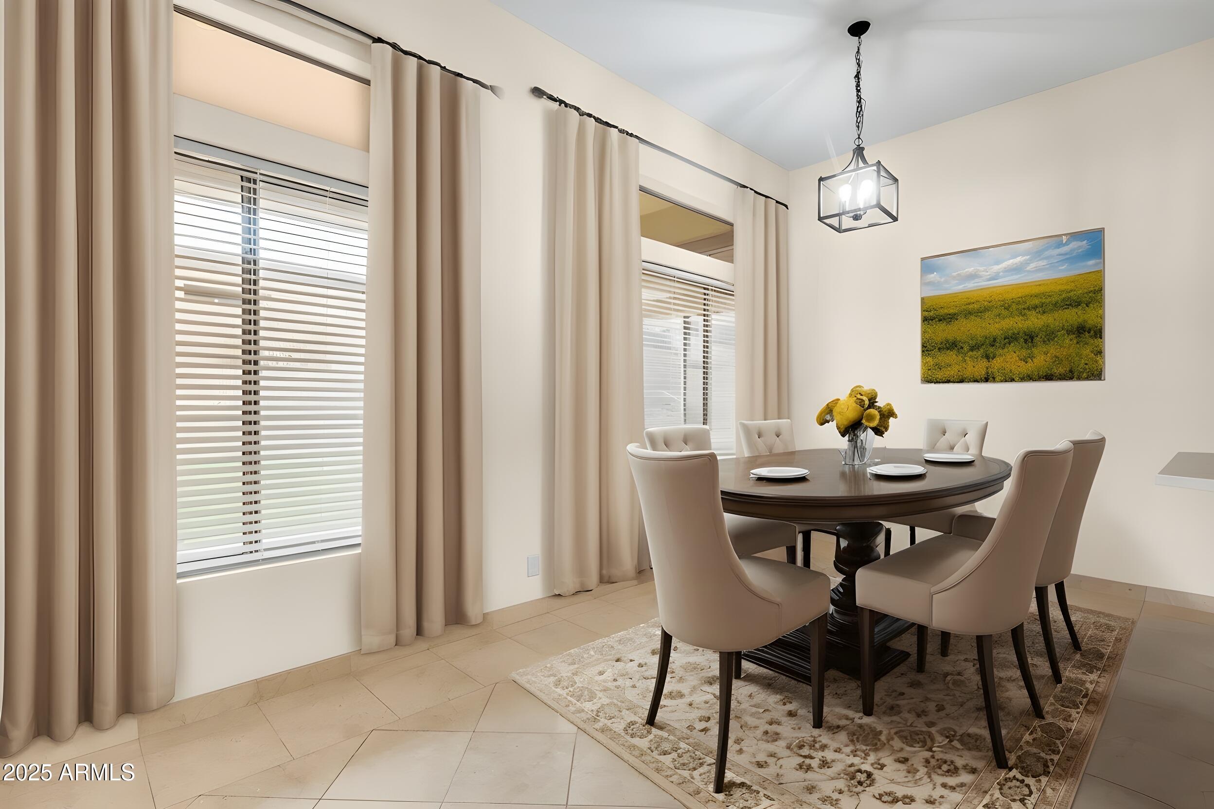3138 West Ravina Lane Anthem, AZ 85086 - Photo 6 of 38 a view of a dining room with furniture window and wooden floor